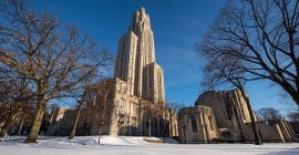 Cathedral of learning in the winter with snow on the ground